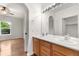 Bathroom featuring double sinks, framed mirror, and natural light at 23456 E 5Th Pl # 104, Aurora, CO 80018
