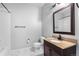 Bathroom with tub, vanity, toilet, and mirror at 23456 E 5Th Pl # 104, Aurora, CO 80018