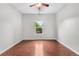 Empty bedroom with ceiling fan and large window at 23456 E 5Th Pl # 104, Aurora, CO 80018
