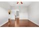 Spacious bedroom featuring hardwood floors, ceiling fan and access to bathroom and kitchen at 23456 E 5Th Pl # 104, Aurora, CO 80018