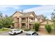 Condo building exterior with multiple balconies and well-maintained landscaping at 23456 E 5Th Pl # 104, Aurora, CO 80018