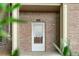 Condo front door with brick facade at 23456 E 5Th Pl # 104, Aurora, CO 80018