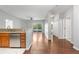 Living area with hardwood floors, open to the kitchen, leading to a private balcony and bedrooms at 23456 E 5Th Pl # 104, Aurora, CO 80018