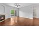 Bright living room with a fireplace and sliding glass door to a balcony at 23456 E 5Th Pl # 104, Aurora, CO 80018