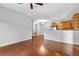 Open concept living room with view of dining area and kitchen at 23456 E 5Th Pl # 104, Aurora, CO 80018