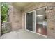 Brick patio with sliding door access to living area at 23456 E 5Th Pl # 104, Aurora, CO 80018