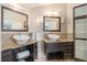A spacious bathroom with dual vessel sinks, granite countertops, and wood cabinets at 345 Fillmore St # 409, Denver, CO 80206