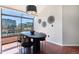Bright dining area boasting city views through large windows and stylish contemporary lighting at 345 Fillmore St # 409, Denver, CO 80206
