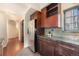 Kitchen area features modern cabinets with granite countertops and stainless steel refrigerator at 345 Fillmore St # 409, Denver, CO 80206