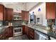 An updated kitchen with stainless steel appliances, granite countertops, and pendant lighting at 345 Fillmore St # 409, Denver, CO 80206