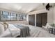 Large main bedroom with windows and ensuite bath with vaulted ceilings and closet at 345 Fillmore St # 409, Denver, CO 80206