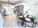 Modern kitchen with stainless steel appliances, white cabinets, and a dining area at 5721 W 92Nd Ave # 66, Westminster, CO 80031