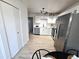 Stylish kitchen with stainless steel appliances, white cabinets, and modern track lighting at 5721 W 92Nd Ave # 66, Westminster, CO 80031