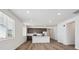 Bright open-concept kitchen featuring stainless steel appliances and a center island at 2668 Simpson Ln, Erie, CO 80026