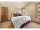 Bright bedroom with a double bed and plenty of natural light at 187 Fox Ridge Dr, Evergreen, CO 80439