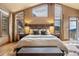 Large bedroom with mountain views and private access to deck at 187 Fox Ridge Dr, Evergreen, CO 80439