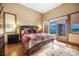 Bedroom with mountain views and access to private deck at 187 Fox Ridge Dr, Evergreen, CO 80439