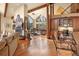 Open living space with hardwood floors and a fireplace at 187 Fox Ridge Dr, Evergreen, CO 80439