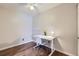 Bright bedroom featuring a white desk, ceiling fan, and stylish flooring at 3653 S Sheridan Blvd # 16, Denver, CO 80235