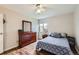 Bedroom featuring hardwood floors, a ceiling fan, and natural light at 3653 S Sheridan Blvd # 16, Denver, CO 80235