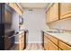 Kitchen featuring modern appliances and ample cabinet space at 3653 S Sheridan Blvd # 16, Denver, CO 80235
