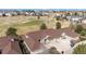 Aerial view of beautiful homes situated next to a golf course and well-manicured lawns at 7683 S Biloxi Way, Aurora, CO 80016