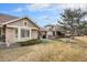 Spacious backyard with patio area and views of neighboring homes and landscape at 7683 S Biloxi Way, Aurora, CO 80016