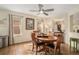 Charming dining room with hardwood floors, a ceiling fan, and a view into the living room at 7683 S Biloxi Way, Aurora, CO 80016