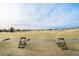 Golf course driving range with manicured greens and scenic views at 7683 S Biloxi Way, Aurora, CO 80016