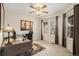 Bright home office with two windows, carpeted floors and an overhead ceiling fan with light fixture at 7683 S Biloxi Way, Aurora, CO 80016