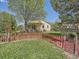 Spacious backyard featuring a charming picket fence and a lush lawn at 1649 Iris St, Broomfield, CO 80020