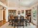 Dining room featuring classic furniture, a chandelier, and a view to the exterior through patterned curtains at 1649 Iris St, Broomfield, CO 80020