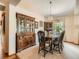Elegant dining room with a vintage hutch, chandelier, and a large table perfect for entertaining guests at 1649 Iris St, Broomfield, CO 80020