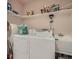 Functional laundry room with a washer, dryer, and sink, providing convenience at 1649 Iris St, Broomfield, CO 80020