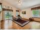 Bright living room with hardwood floors, vaulted ceiling, and sliding glass doors to the backyard at 1649 Iris St, Broomfield, CO 80020