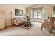 Cozy living room with a bay window, patterned sofa, and classic decor creating a welcoming ambiance at 1649 Iris St, Broomfield, CO 80020