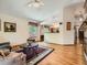 Spacious living room with hardwood floors, comfortable seating, and a view of the kitchen at 1649 Iris St, Broomfield, CO 80020
