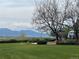Scenic view of park with playground and mountains in the background at 1649 Iris St, Broomfield, CO 80020