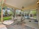 Covered patio featuring an outdoor seating area and access to an enclosed sunroom at 1649 Iris St, Broomfield, CO 80020