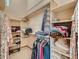 Organized walk-in closet with shelves and hanging rods for ample storage at 1649 Iris St, Broomfield, CO 80020