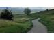 Scenic walking path in a green area with mountain views offering outdoor recreation and a peaceful environment at 1649 Iris St, Broomfield, CO 80020