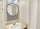 Bathroom features attractive mirror, sink, and shower with trendy decorative wallpaper at 19897 E Brunswick Dr, Aurora, CO 80013
