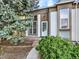Inviting entryway with a covered porch, large windows and well-maintained landscaping at 19897 E Brunswick Dr, Aurora, CO 80013
