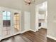 Open living area with hardwood floors, access to deck, and eat-in kitchen at 19897 E Brunswick Dr, Aurora, CO 80013