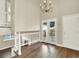 Bright living area with staircase, large window, and hardwood floors at 19897 E Brunswick Dr, Aurora, CO 80013