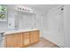 Bright bathroom featuring a double sink vanity, and a shower-tub combination at 11963 Dahlia Dr, Thornton, CO 80233