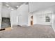 Bright living room featuring neutral carpet, high ceilings, and staircase at 11963 Dahlia Dr, Thornton, CO 80233