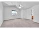 Airy main bedroom with vaulted ceiling, ceiling fan, and ample natural light at 11963 Dahlia Dr, Thornton, CO 80233