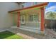 Covered porch with white railing and red accents, creating a welcoming entrance to the home at 11963 Dahlia Dr, Thornton, CO 80233
