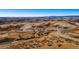 Expansive aerial view of the neighborhood surrounded by vast landscapes and open spaces at 3867 Freestone Pt, Castle Rock, CO 80108